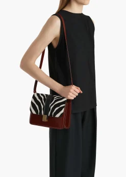 Khaite Crossbody Bags-Blake Crossbody Bag in Zebra Print Haircalf and Oxblood Leather