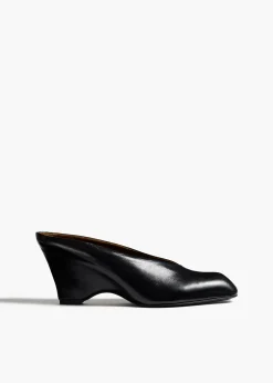 Khaite Mules-Colt Wedge in Black Glazed Leather