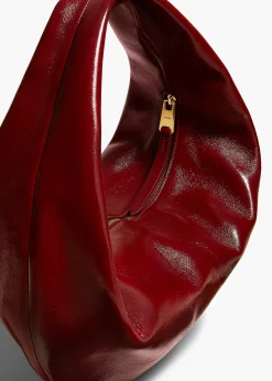 Khaite Shoulder Bags-Medium Olivia Hobo in Oxblood Crackle Patent Leather