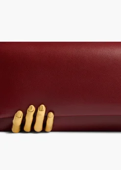 Khaite Evening-Sculpted Hand Clutch in Oxblood Leather